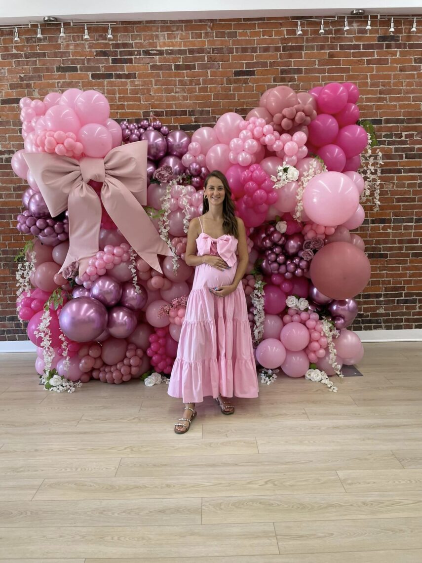 bow themed balloon wall