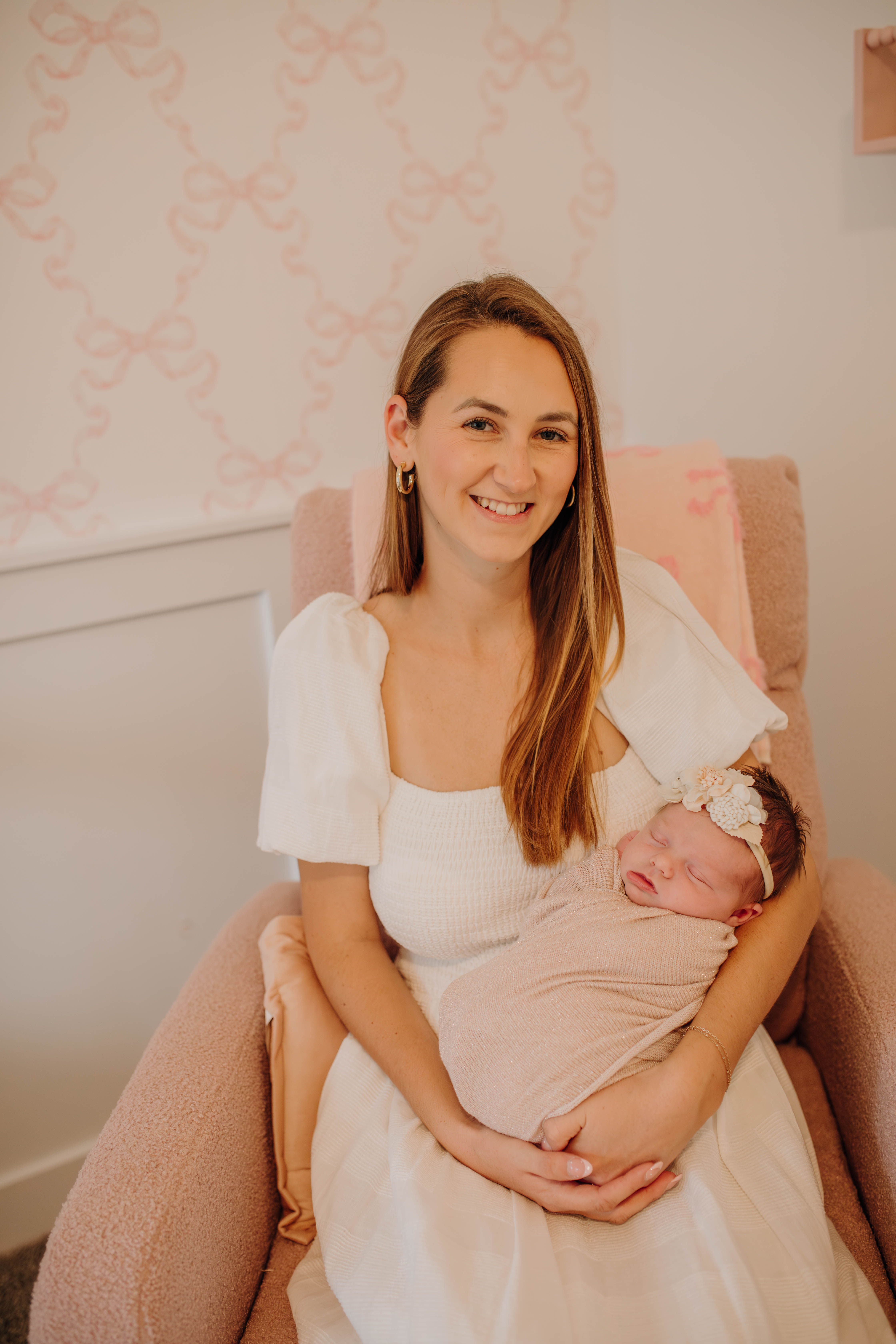 mother holding newborn baby girl