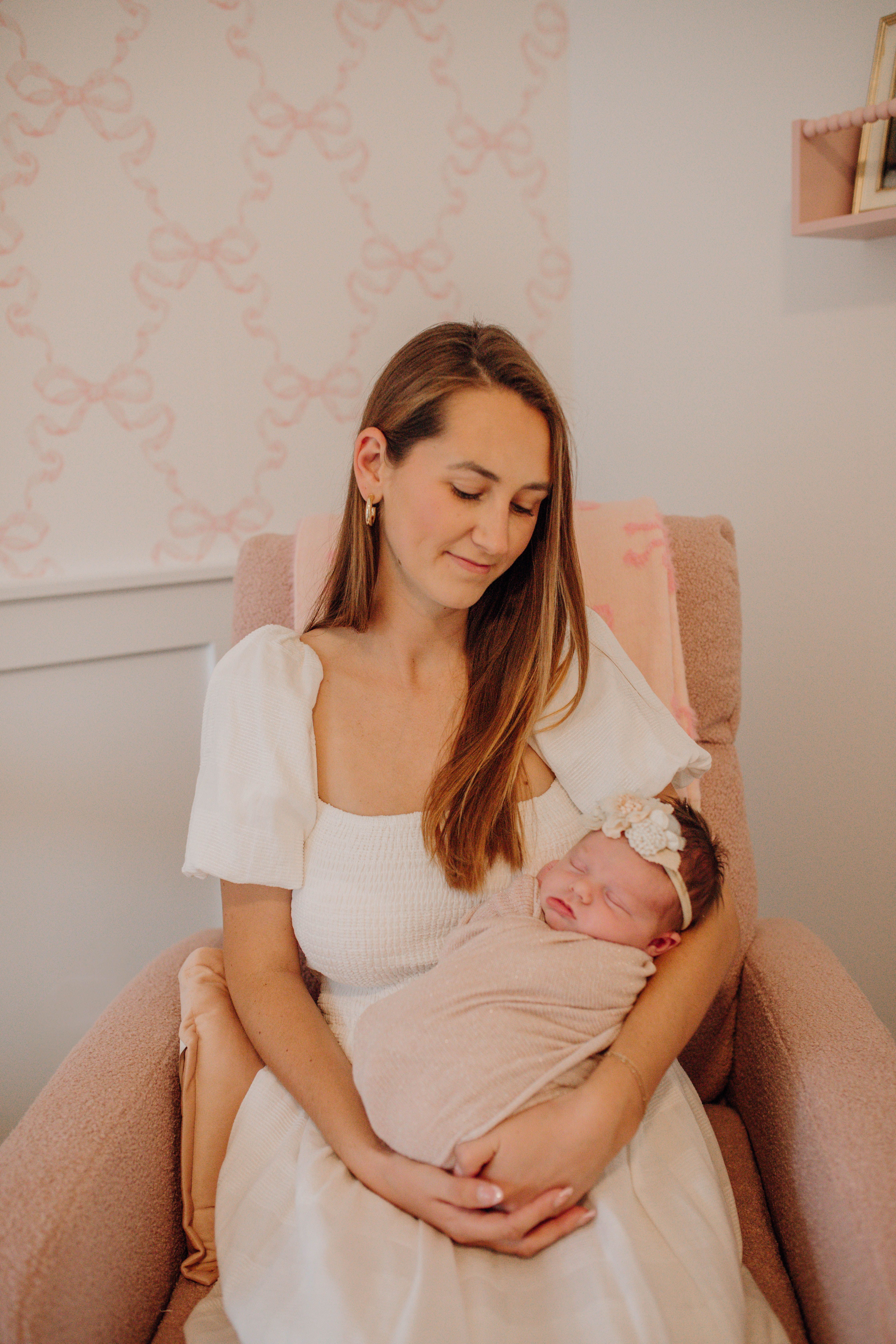 mother holding newborn during photography session