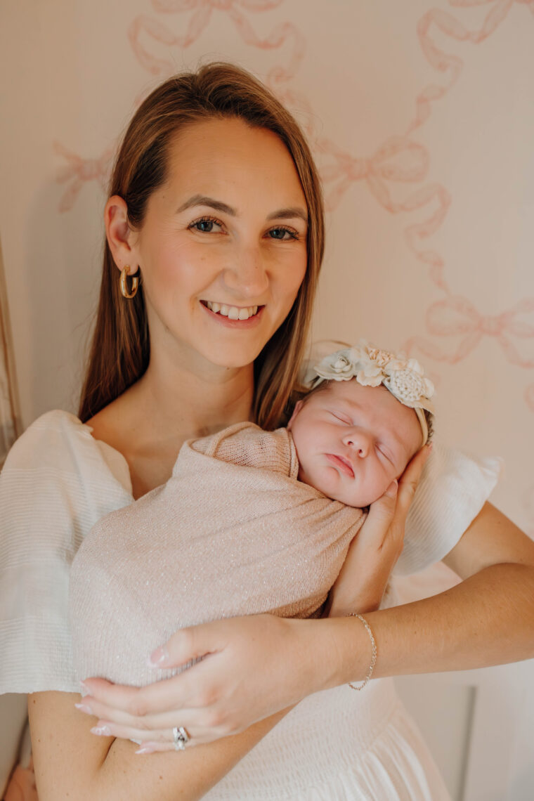 mother holding newborn baby girl